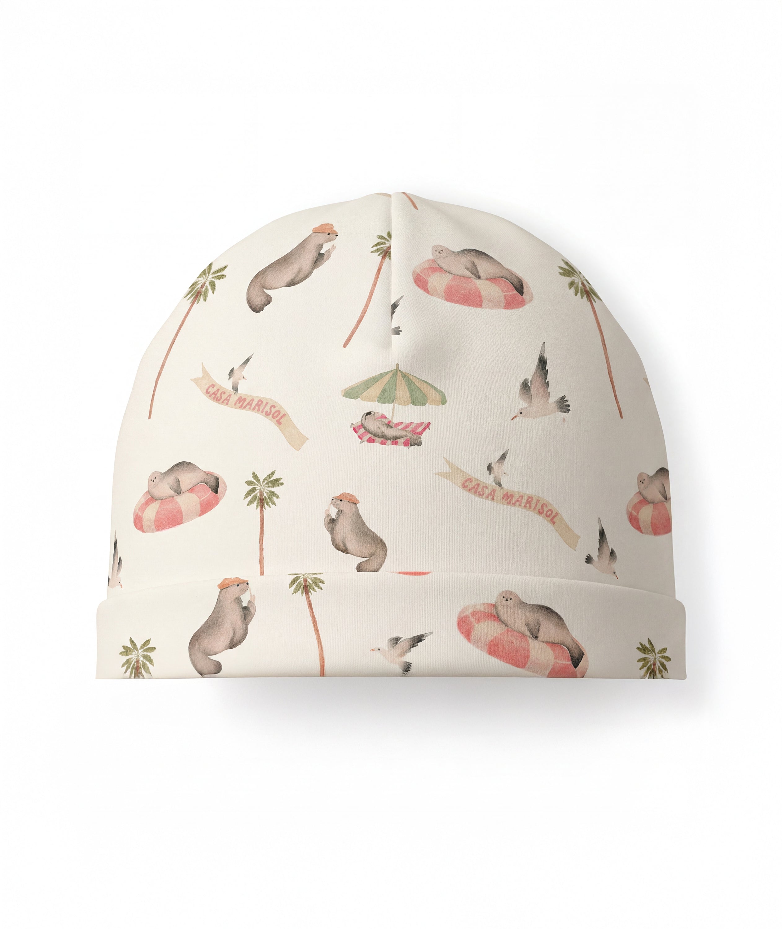 Beanie with seal and palm tree pattern on a white background