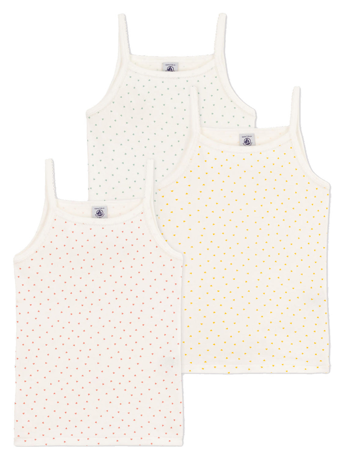 Drei Unterhemden COEUR DE BEURRE 3er Pack in Marshmallow-Stil, mit dünnen Trägern und bunten Punktmustern in Grün, Gelb und Rot.