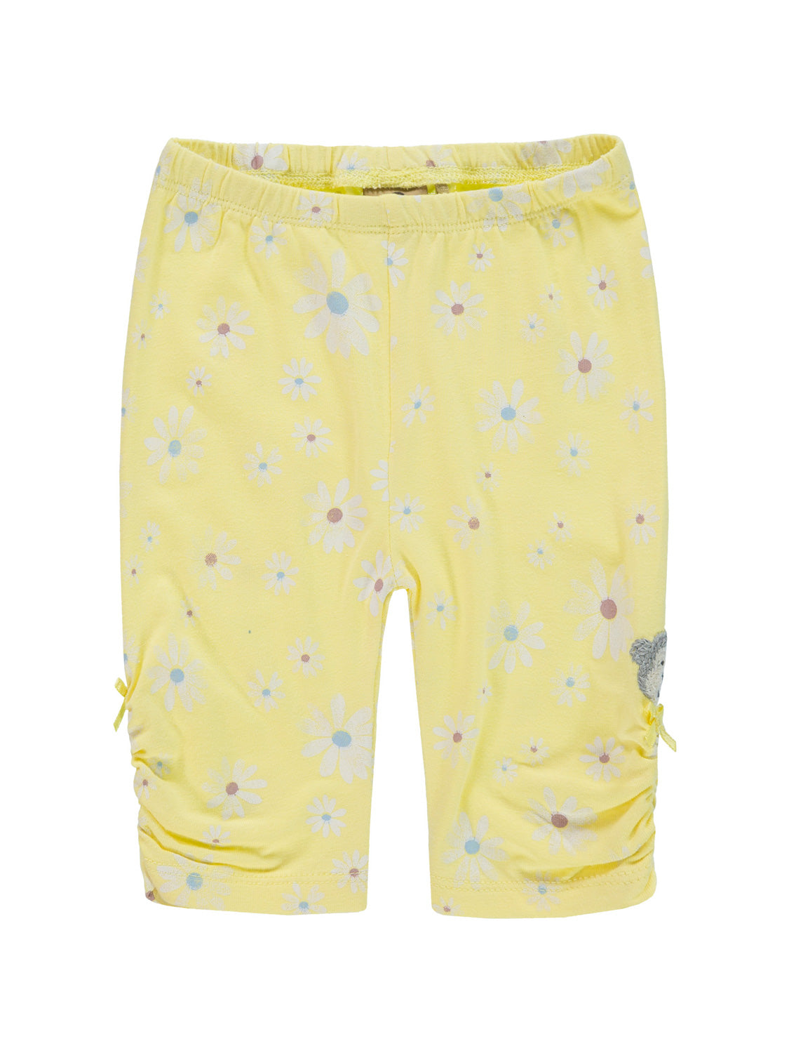 Leggings Gelb: Kinder-Bike-Shorts mit weißen Gänseblümchen, seitlicher Raffung und gelben Schleifen, Teddy-Gesicht-Applikation am Saum, elastischer Bund. Ideal für modische Kids bei bellybutton.