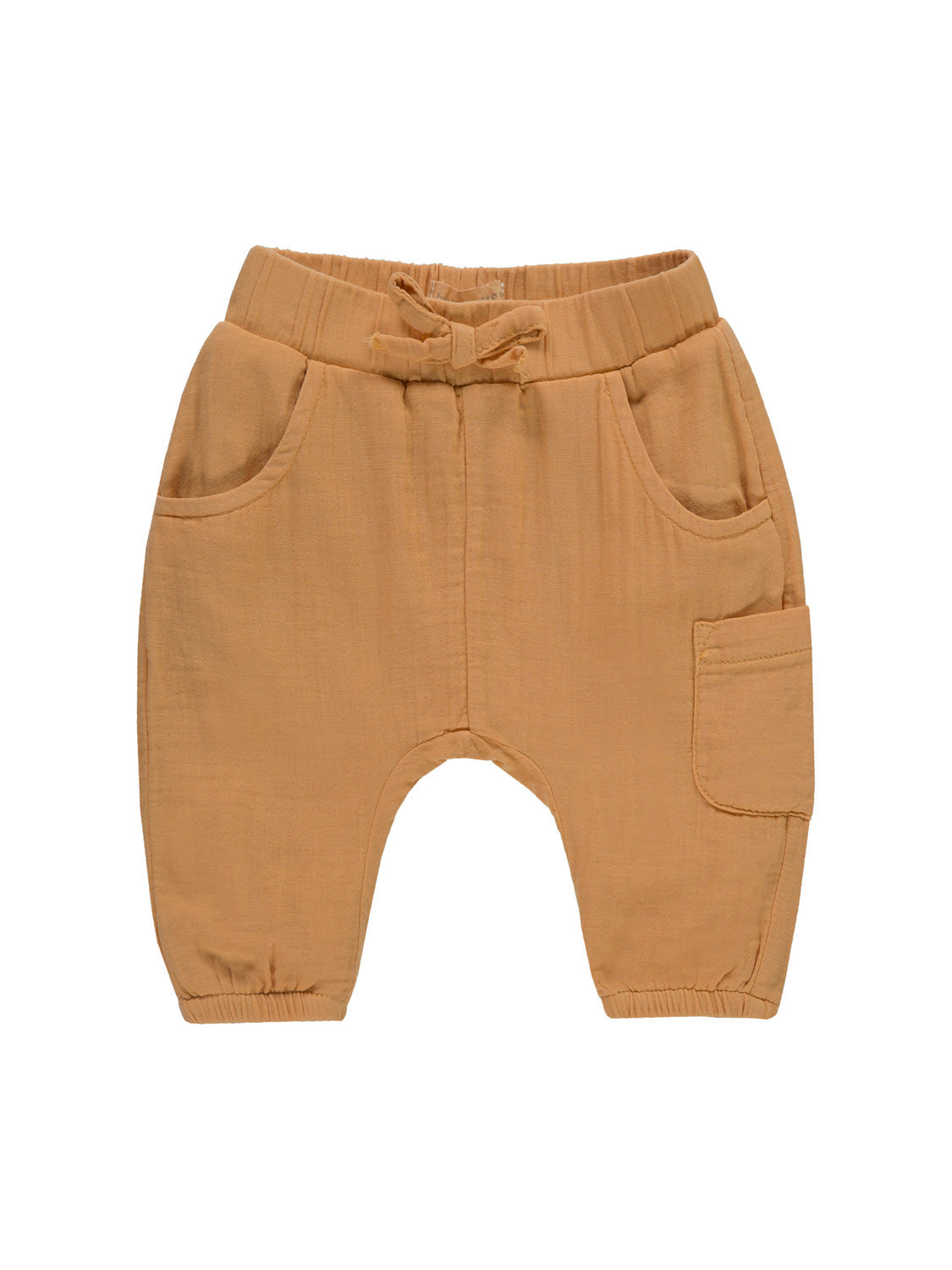 Hose Camel: Weiche, gewebte Babyhose mit elastischem Bund, Stoffkrawatte, zwei Handwärmetaschen vorne, seitlicher Pattentasche und elastischen Knöchelbündchen.